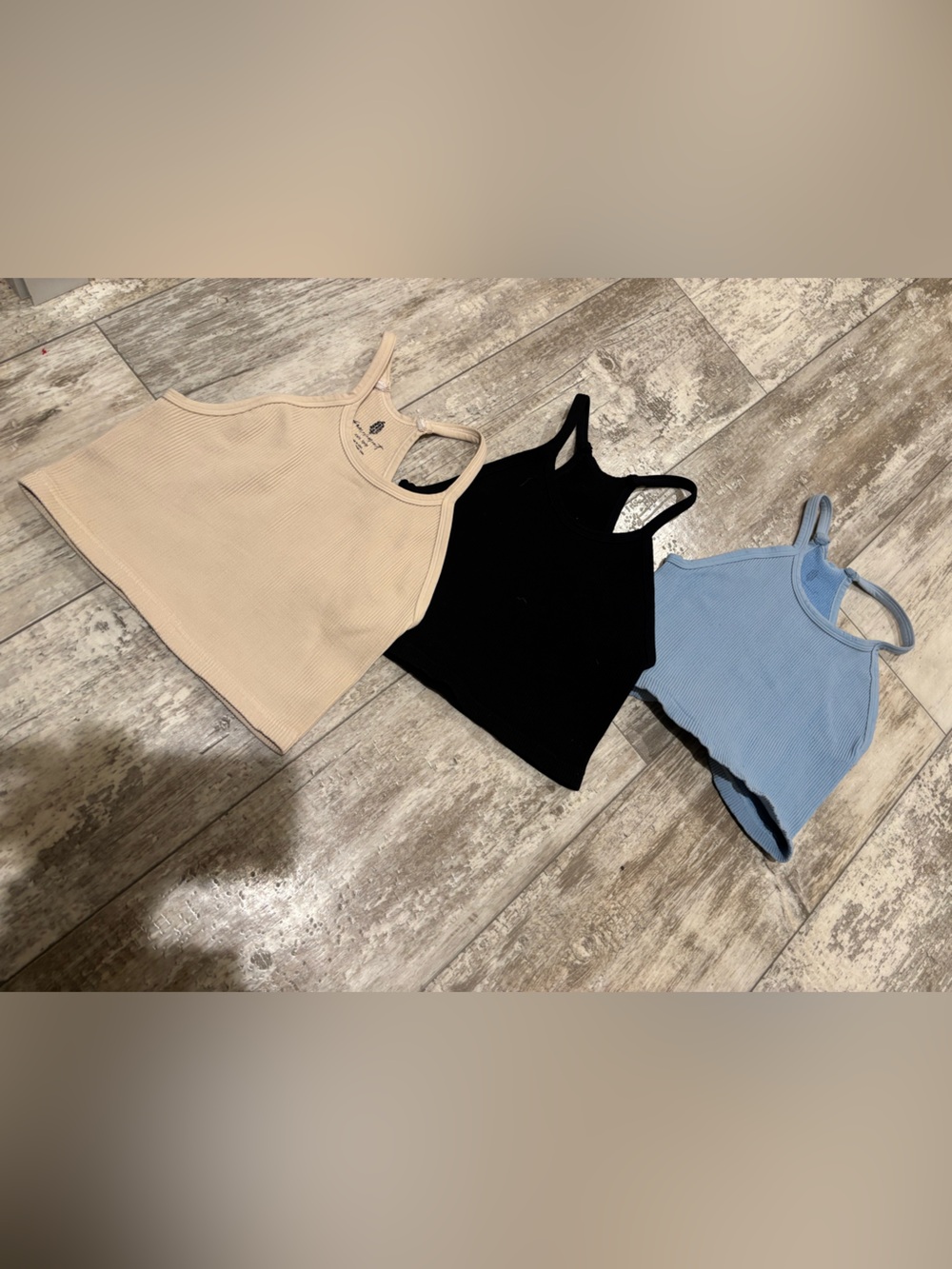 Free People Ribbed Scoop Tank in Black, Blue & Beige.